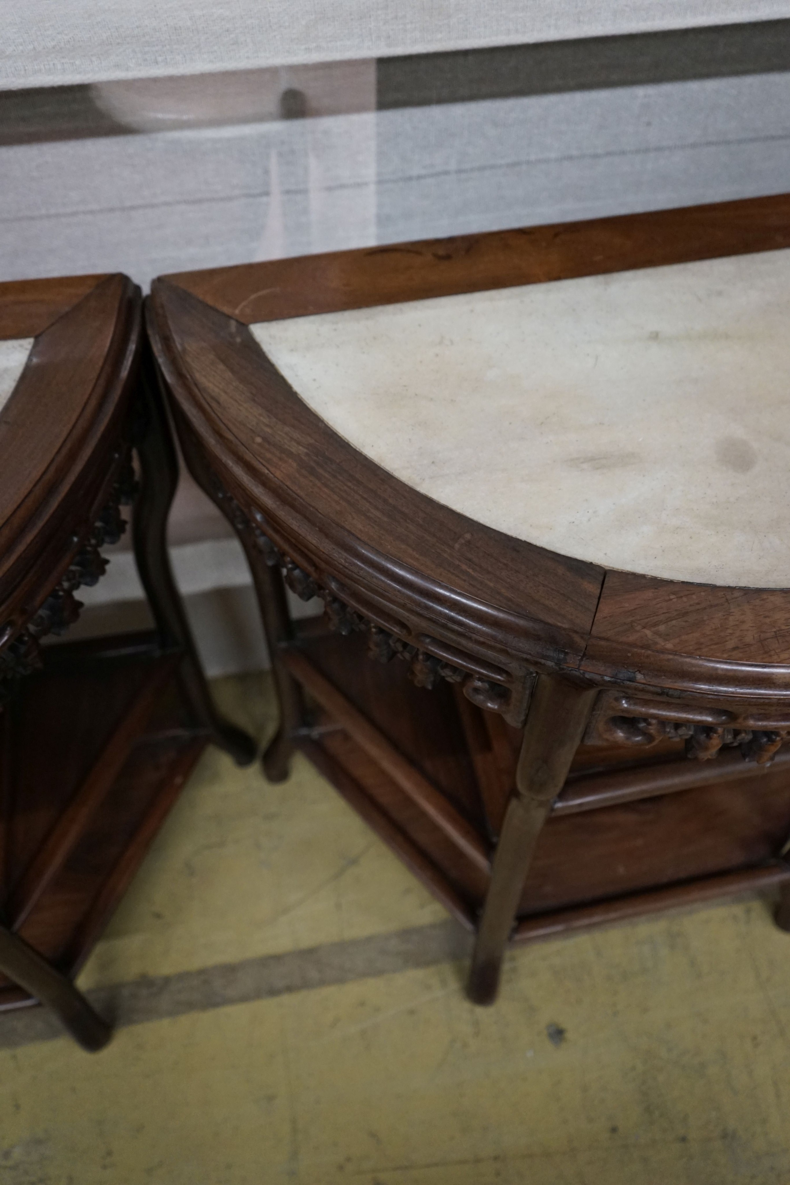 A pair of Chinese marble-topped demi lune console tables, width 82cm, depth 40cm, height 80cm